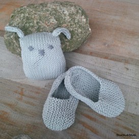 Baby shoes and knitted rabbit, handmade knitwear of organic cotton, grey