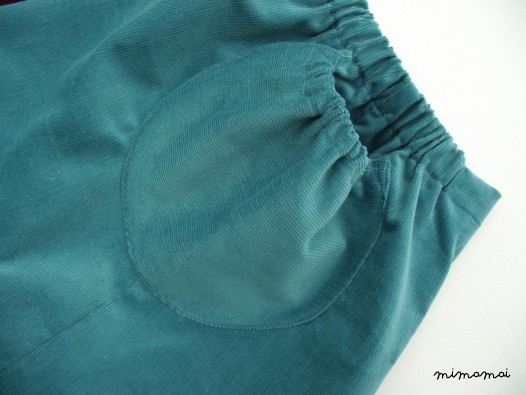 Natural cord skirt with big round ruffled pockets