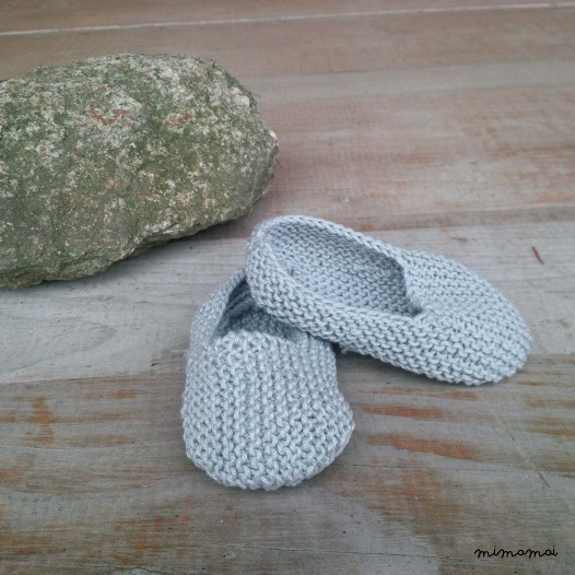 Baby shoes and knitted rabbit, handmade knitwear of organic cotton, grey
