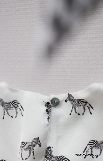 Vanilla baby dress with zebra print