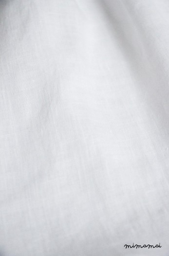 White linen baby dress with Bella brooch