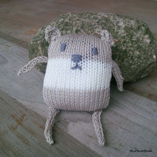 Baby shoes and knitted bear, handmade knitwear of organic cotton, beige and off white