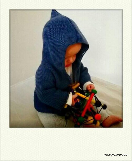 Knitted baby cardigan with pixie hood, knitted in airforce blue